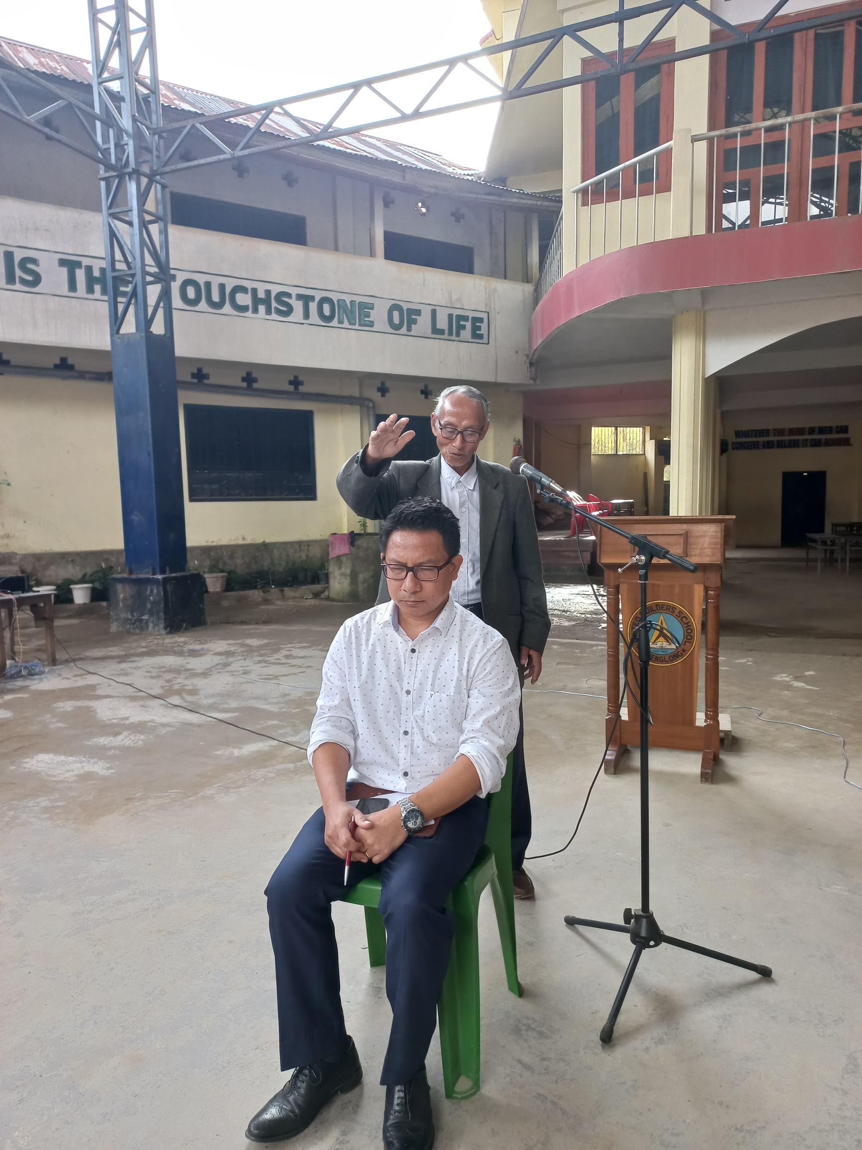 Rev. Mp A Kadi Former Pastor Tamenglong Baptist Church, praying for the Principal.